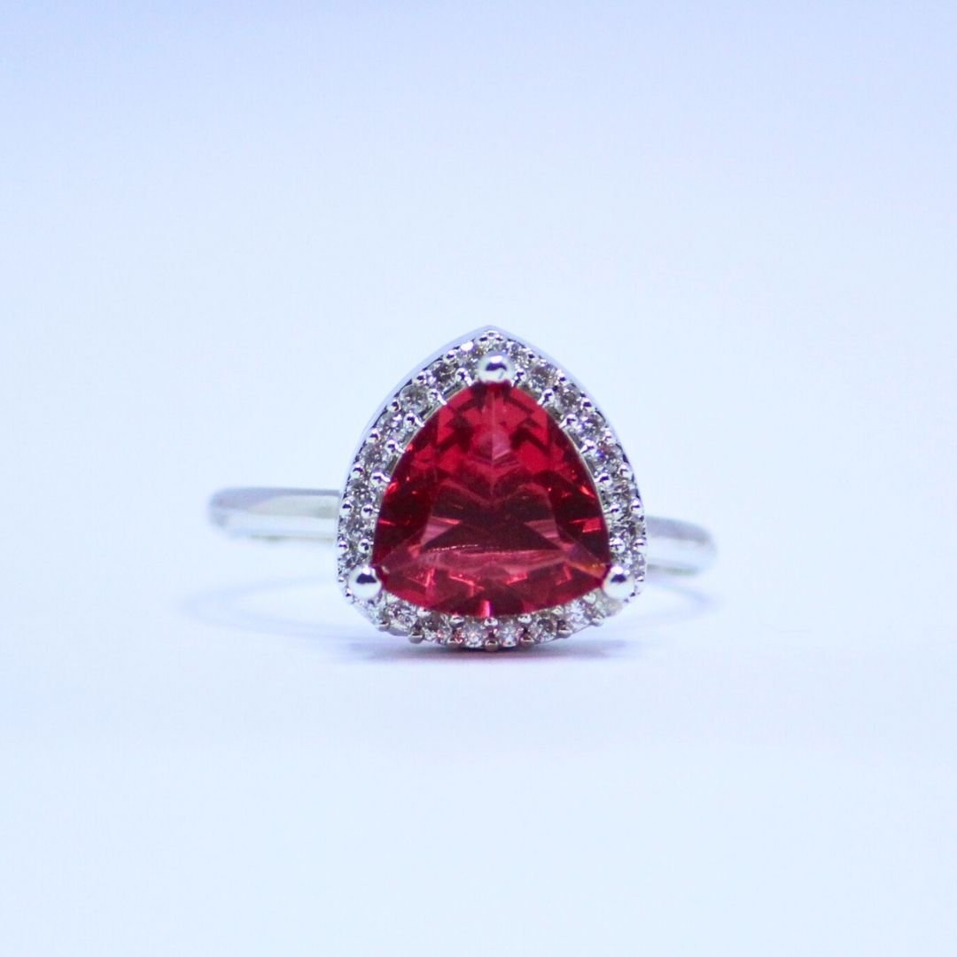 1 Radiant Ruby Red Trillion Cut Ring with Dazzling Halo Accents 1 Radiant Ruby Red Trillion Cut Ring with Dazzling Halo Accents