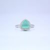 1 Trillion-Cut Aqua AD Ring with a Halo of Dazzling Accents