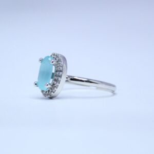Elegant Sky Blue Oval Cut Silver Ring with Diamond Halo Accents
