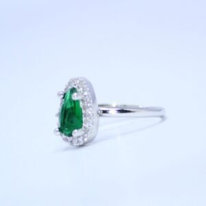 Radiant Pear Cut Emerald Green Accent Ring with a Sparkling Halo of Brilliance