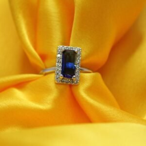 Ring with Blue Sapphire Baguette Cut Accent and Dazzling Halo