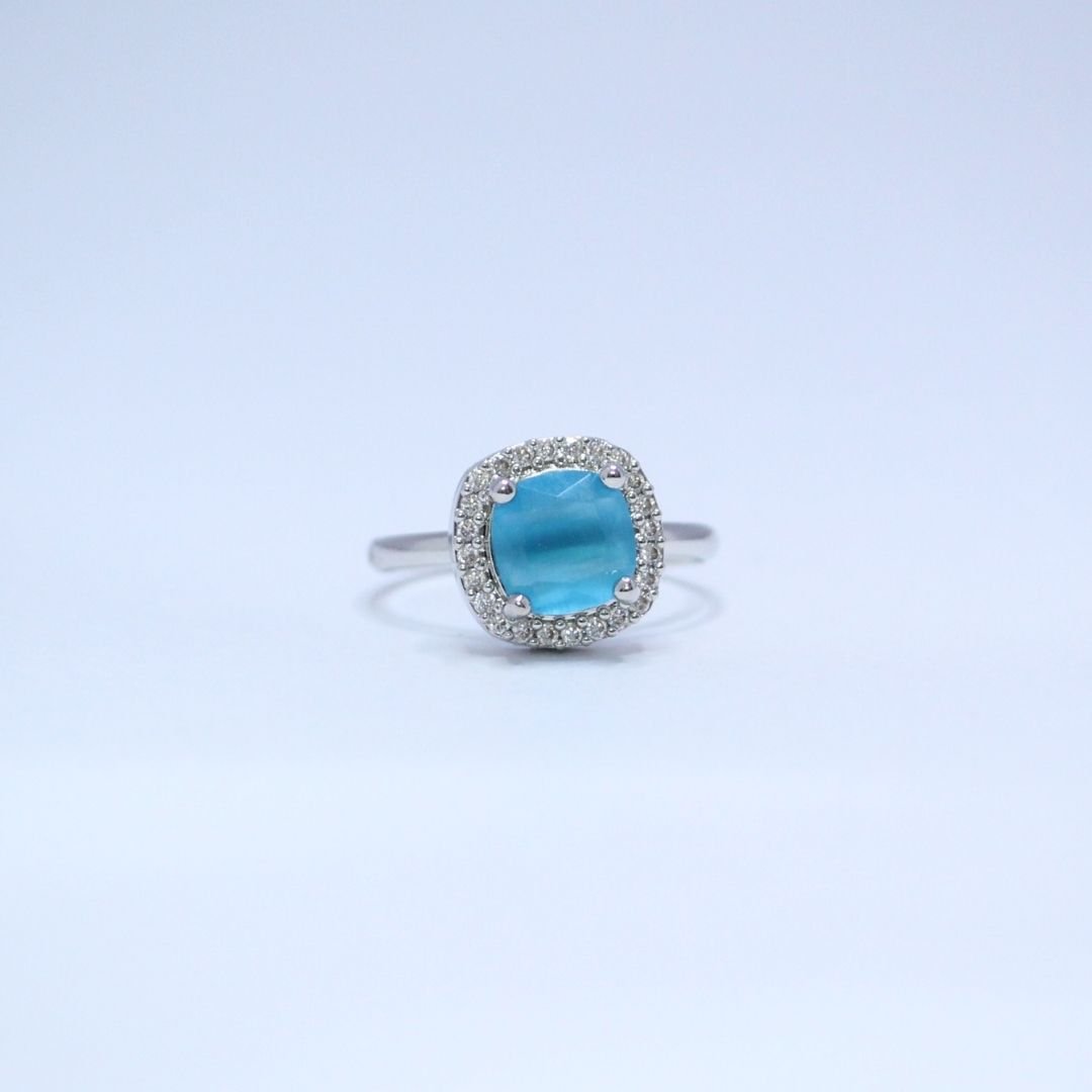 4 Cushion-Cut Azure Sky Blue Ring with Radiant Halo sparkling accents Cushion-Cut Azure Sky Blue Ring with Radiant Halo sparkling accents