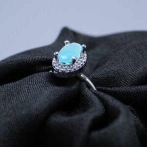 Elegant Sky Blue Oval Cut Silver Ring with Diamond Halo Accents