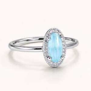 Elegant Sky Blue Oval Cut Silver Ring with Diamond Halo Accents