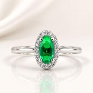 Radiant Oval Emerald Green Accent Ring with Shimmering Halo