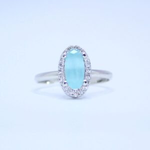 Elegant Sky Blue Oval Cut Silver Ring with Diamond Halo Accents