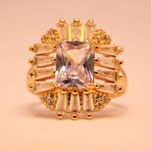 Exquisite Emerald-Cut Centerpiece Ring with Radiant Baguette and Pave Halo