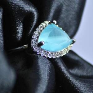 Trillion-Cut Sky Blue Ring with Radiant Halo Accents