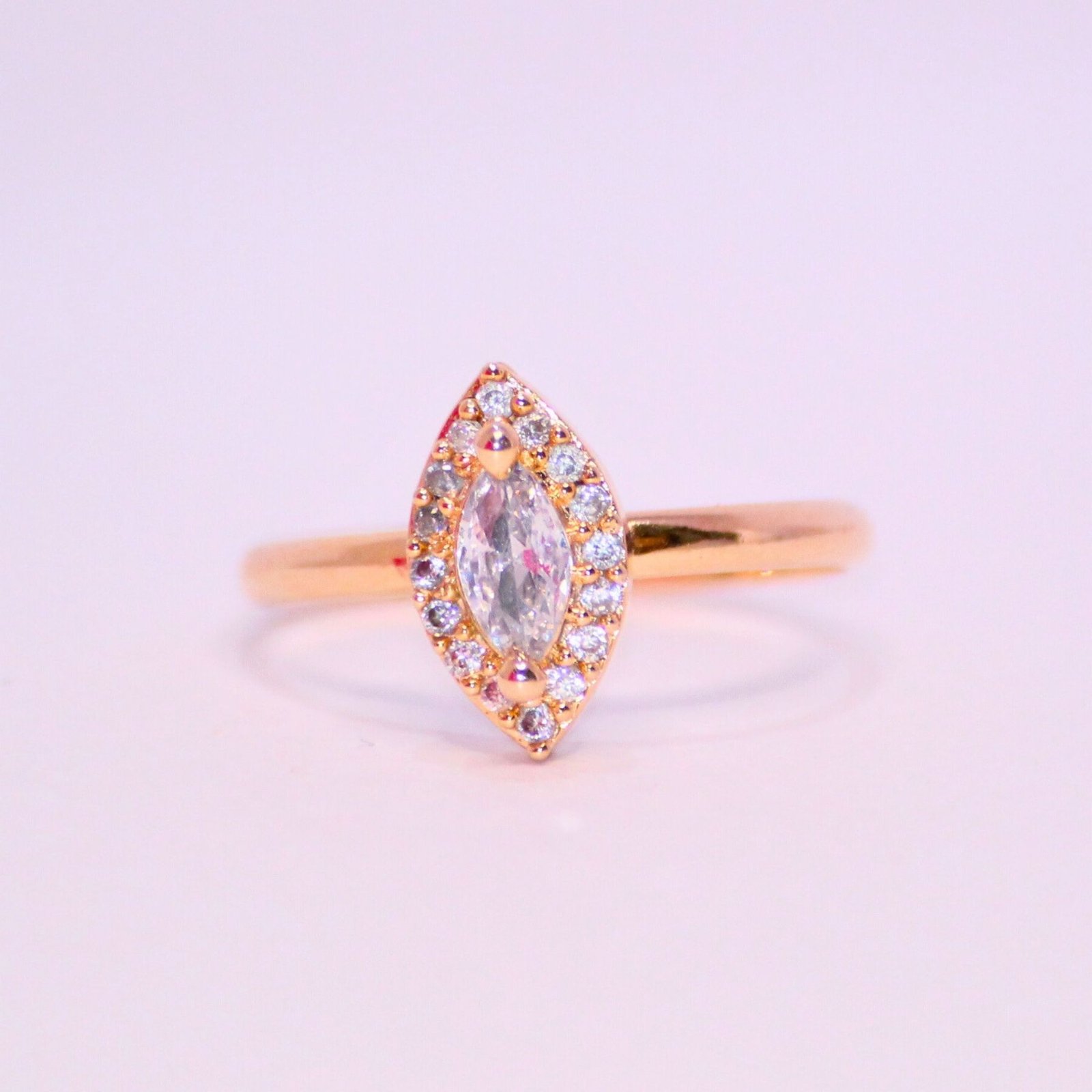 Graceful-Oval-Cut-Halo-Ring-in-Warm-Gold