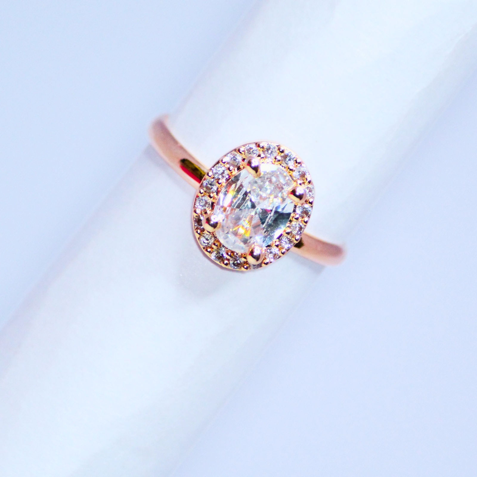 Graceful-Oval-Cut-Halo-Ring-in-Warm-Gold