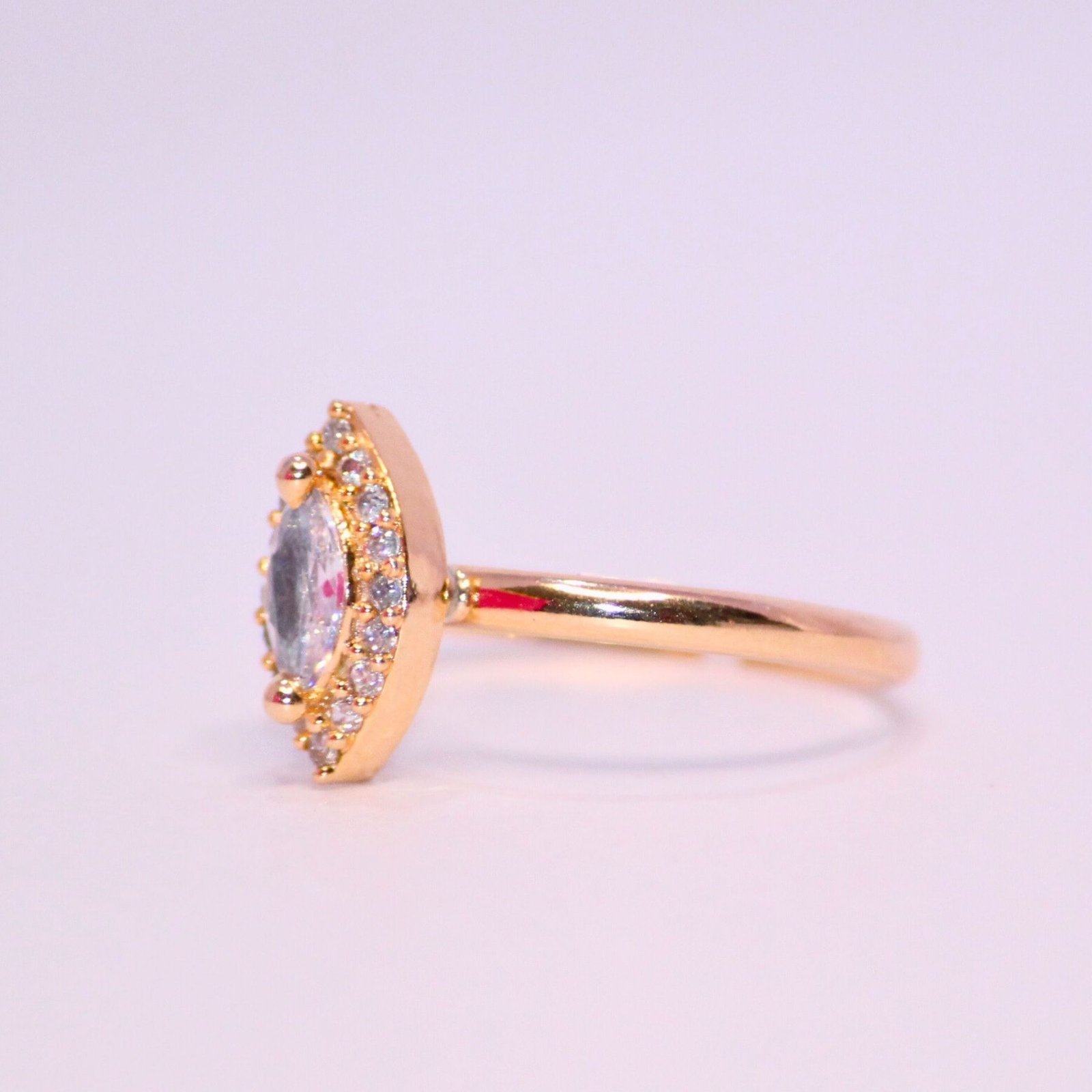 Graceful-Oval-Cut-Halo-Ring-in-Warm-Gold-2