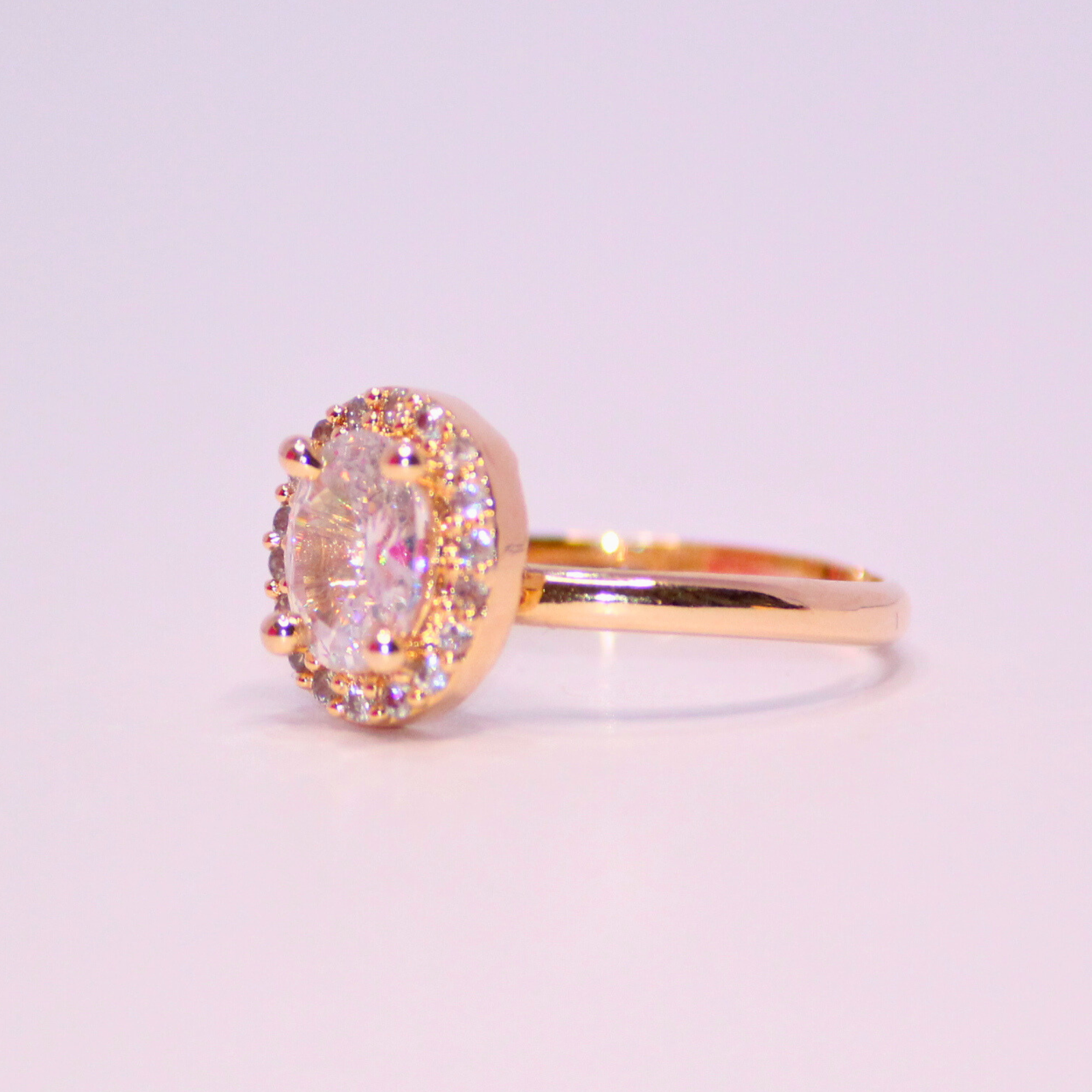 Graceful-Oval-Cut-Halo-Ring-in-Warm-Gold-3