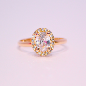 Graceful Oval Cut Halo Ring in Warm Gold