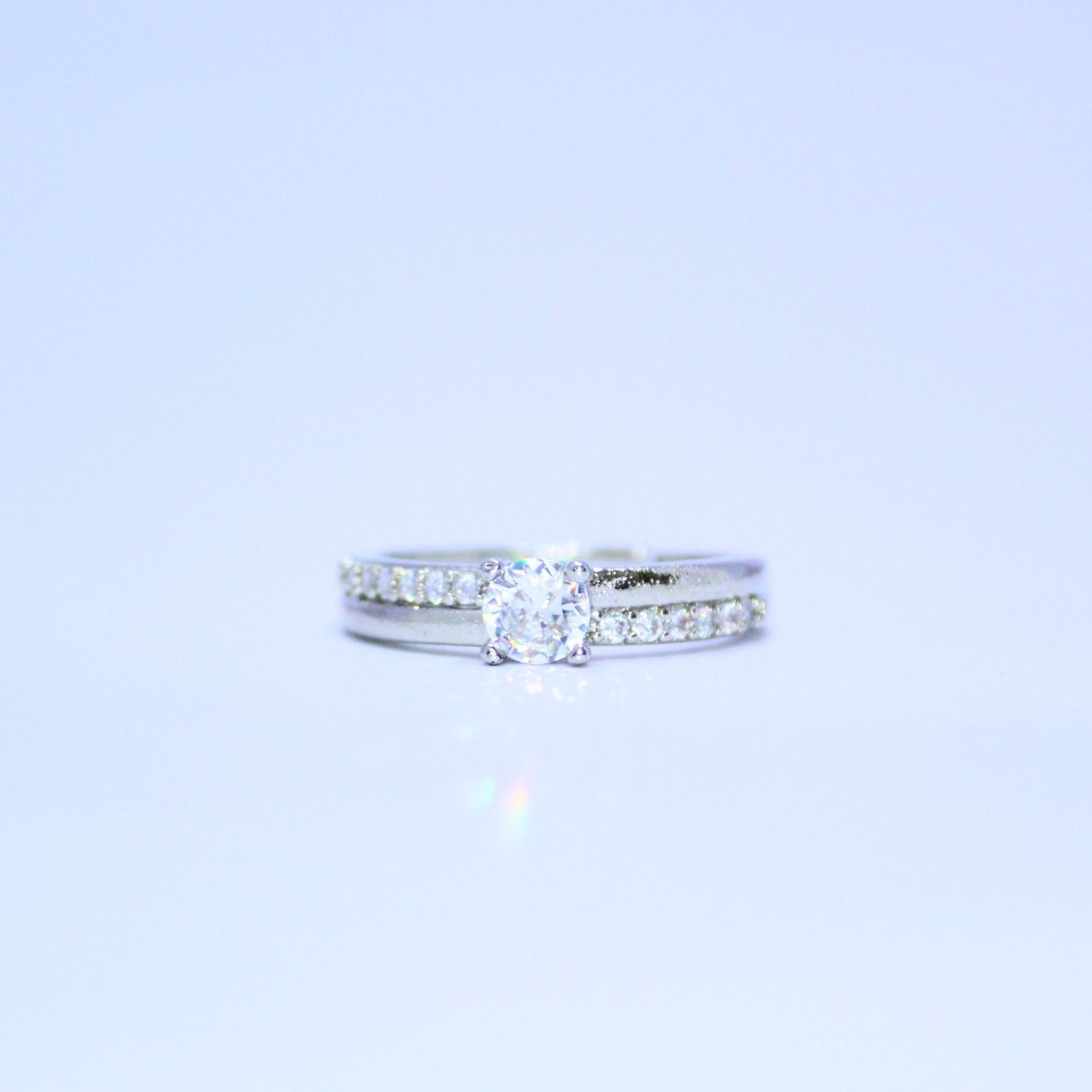 timeless-solitaire-ring-with-a-pave-accented-band